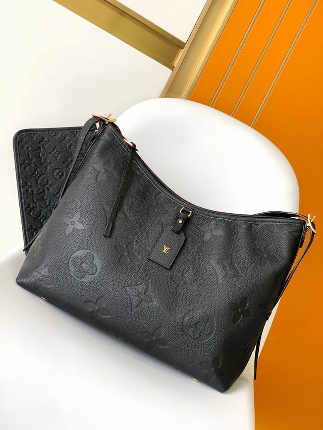 M46289黑色 M46292杏色顶级原单 本款 CarryAll 中号手袋取材 Monogram Empreinte 压纹皮革，以柔软质地贴合身形。考究内层设